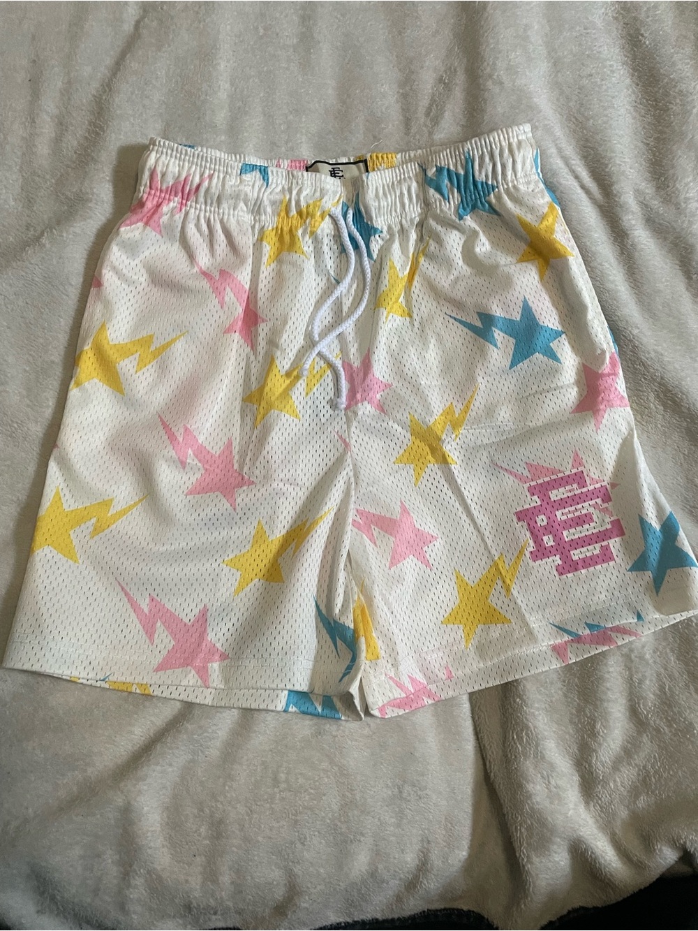 Eric Emanuel x Bape White Mesh Shorts with Pink Yellow & Blue Star Print